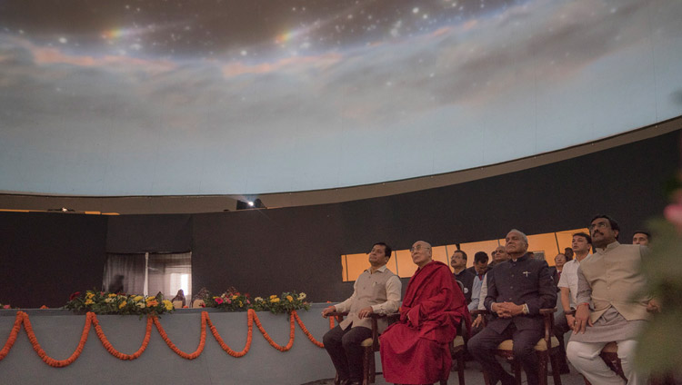 His Holiness the Dalai Lama and special guests watching a video display in a specially fashioned dome at the Namami Brahmaputra Festival in Guwahati, Assam, India on April 2, 2017. Photo by Tenzin Choejor/OHHDL