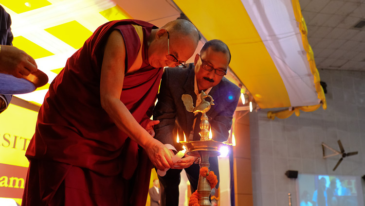 His Holiness the Dalai Lama and Registrar Prof M N Dutta lighting a lamp to inaugurate the program at Dibrugarh University in Dibrugarh, Assam, India on April 3, 2017. Photo by Ven Lobsang Kunga/OHHDL