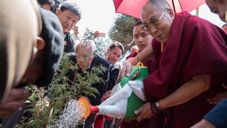 His Holiness the Dalai Lama planting a tree to inaugurate the project to plant 100,000 saplings at the conclusion of his teachings at the Yiga Choezin teaching ground in Tawang, Arunachal Pradesh, India on April 10, 2017. Photo by Tenzin Choejor/OHHDL