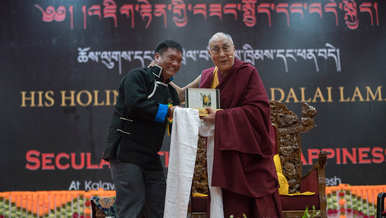 Arunachal Chief Minister Pema Khandu presenting His Holiness the Dalai Lama with a souvenir at the start of his talk at the Kalawangpo Convention Centre in Tawang, Arunachal Pradesh, India on April 10, 2017. Photo by Tenzin Choejor/OHHDL