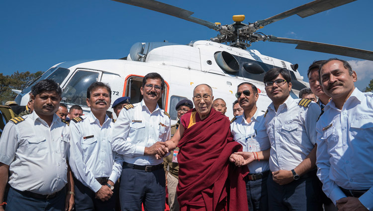 His Holiness the Dalai Lama with the helicopter flight crew before his departure for Guwahati from the helipad in Tawang, Arunachal Pradesh, India on April 11, 2017. Photo by Tenzin Choejor/OHHDL