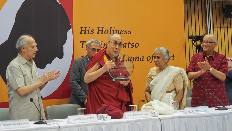 His Holiness the Dalai Lama holding a plaque denoting his receipt of the Professor ML Sondhi Prize for International Politics presented to him in New Delhi, India on April 27, 2017. Photo by Jeremy Russell/OHHDL