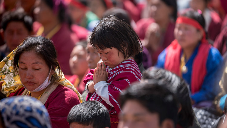 A young member of the crowd listening to His Holiness the Dalai Lama speaking on the second day of his teachings at the Yiga Choezin teaching ground in Tawang, Arunachal Pradesh, India on April 9, 2017. Photo by Tenzin Choejor/OHHDL