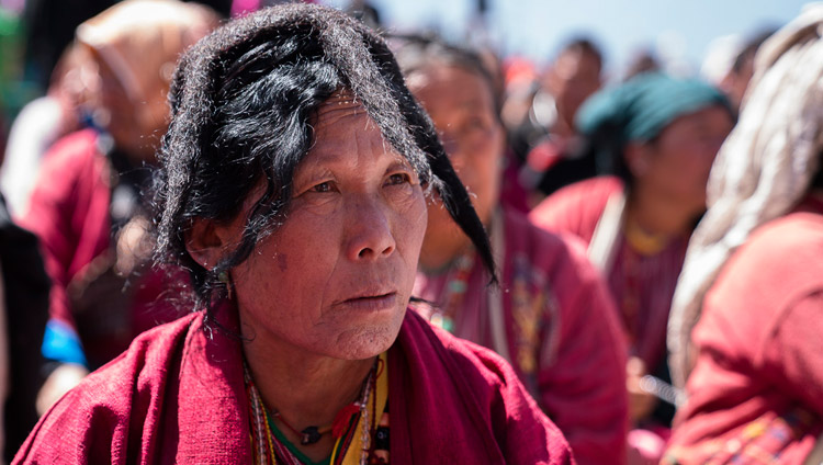 A member of the crowd of over 50,000 listening to His Holiness the Dalai Lama on the final day of his teachings at the Yiga Choezin teaching ground in Tawang, Arunachal Pradesh, India on April 10, 2017. Photo by Tenzin Choejor/OHHDL